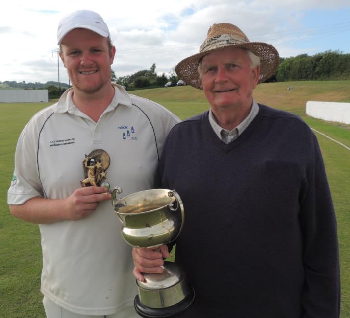 Brennan Martin shares silverware with his grandfather Evan